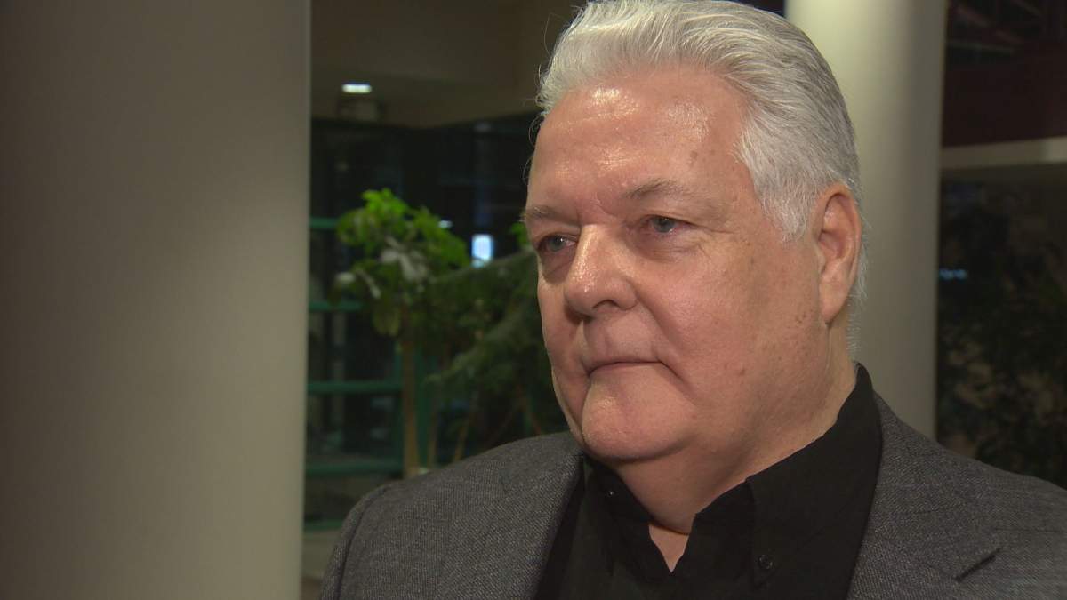 Dale Hicks, a founding board member of Rising Tide and president of Food Depot Alimentaire, speaks to reporters after presenting to Moncton city councillors Tuesday