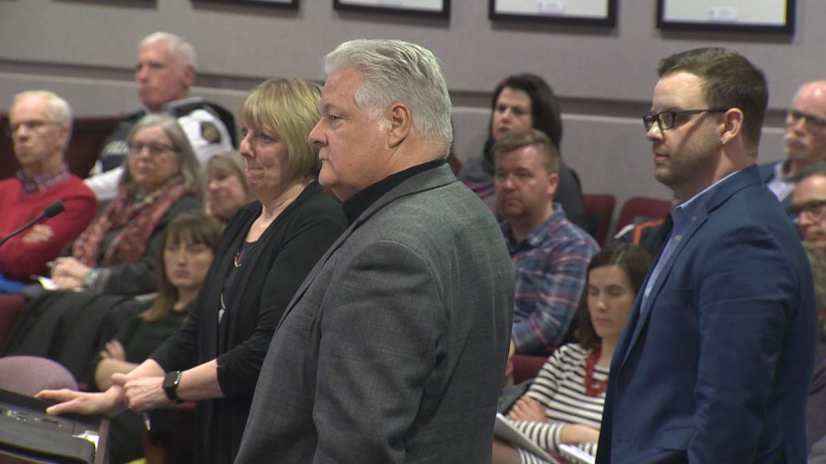 FILE PHOTO - Dale Hicks (centre) and Debbie McInnis (left), representing Rising Tide Community Initiatives Inc., a new non-profit, and Vincent Merola (right) a community development officer with the City of Moncton.