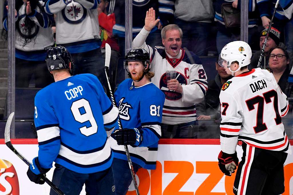 The Winnipeg Jets' Kyle Connor (81) celebrates his short-handed goal against the Chicago Blackhawks with Andrew Copp (9) during second-period NHL action in Winnipeg on Sunday, Feb. 9, 2020.