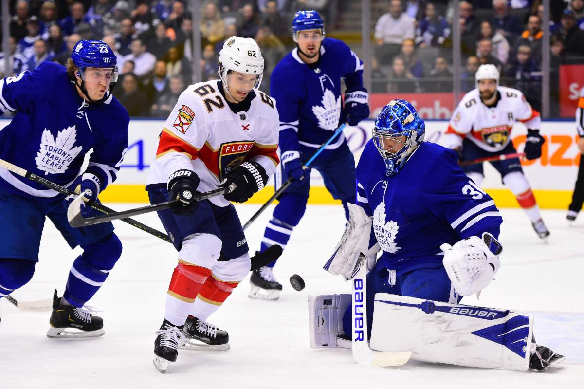 Florida Panthers centre Denis Malgin (62) moves in on Toronto Maple Leafs goaltender Frederik Andersen (31) as Leafs Travis Dermott (23) defends during first period NHL hockey action in Toronto, Monday, Feb.3, 2020.