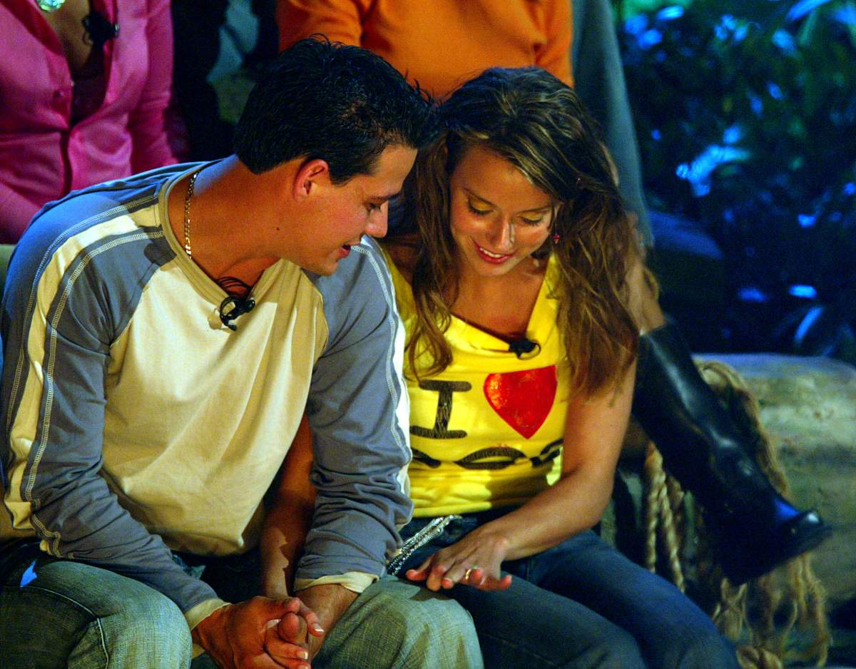 ‘Survivor: All-Stars’ cast members “Boston Rob” Mariano and Amber Brkich look at Amber’s engagement ring after Rob proposed marriage and Amber accepted on the set of the ‘Survivor: All-Stars’ finale at Madison Square Garden on May 9, 2004 in New York City. (Photo by Scott Gries/Getty Images)