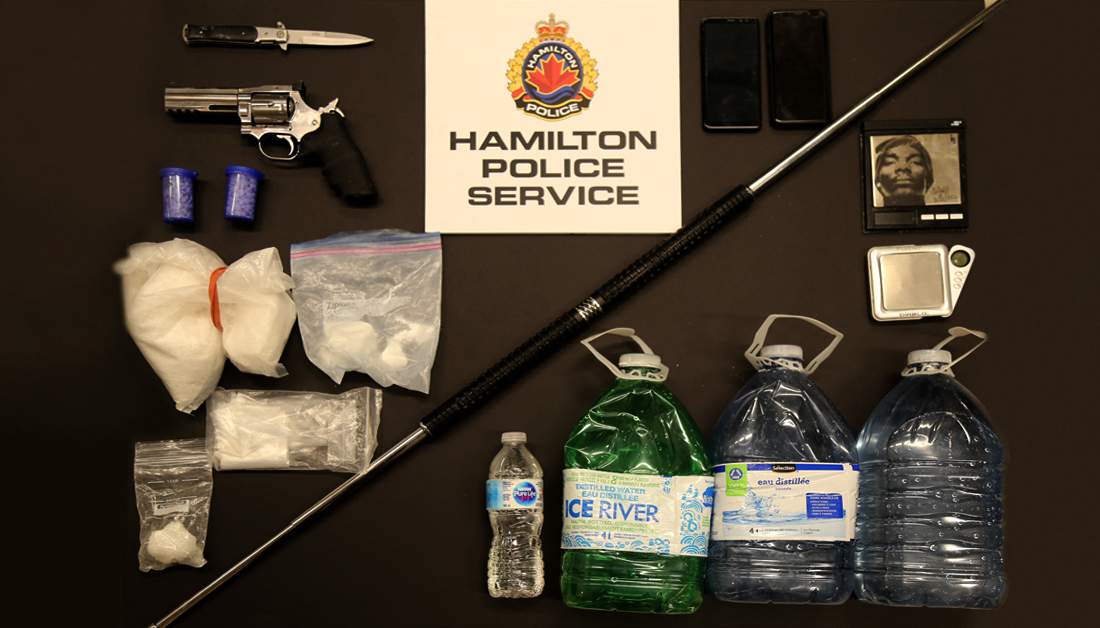 Hamilton Police say they seized weapons, cash and about $100,000 in cocaine and other drugs from a Grimsby home on Feb 12, 2020.