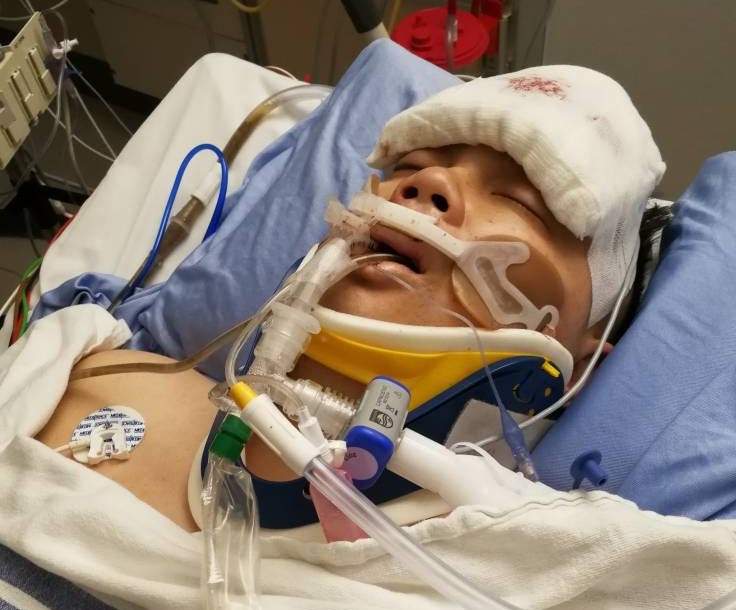 Herman Koo in hospital after being shot in the head.