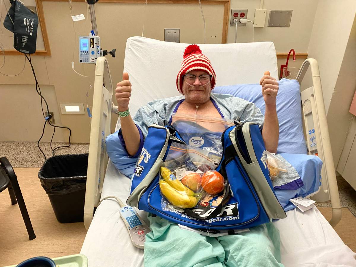 James Hyde posing with one of his care packages.