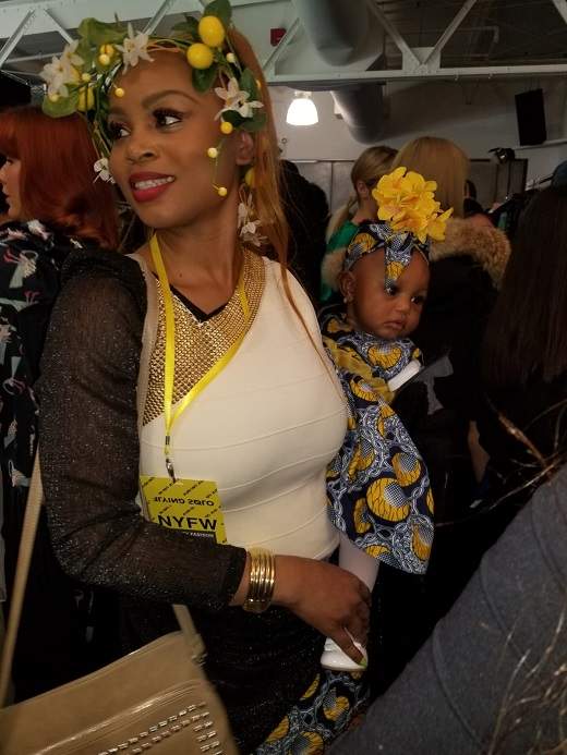 Jibs Abitoye and one of her children at New York Fashion Week