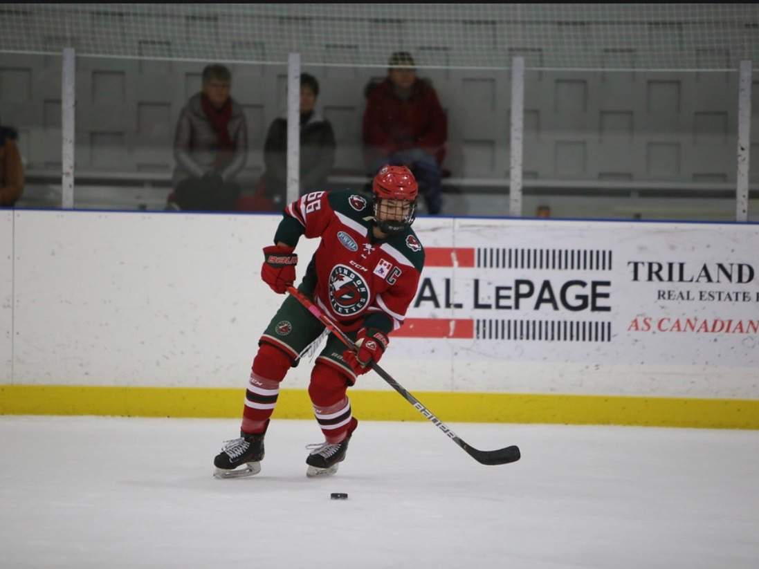 Captain of the London Junior Devilettes Nicole Gosling regroups with the puck in her own zone.