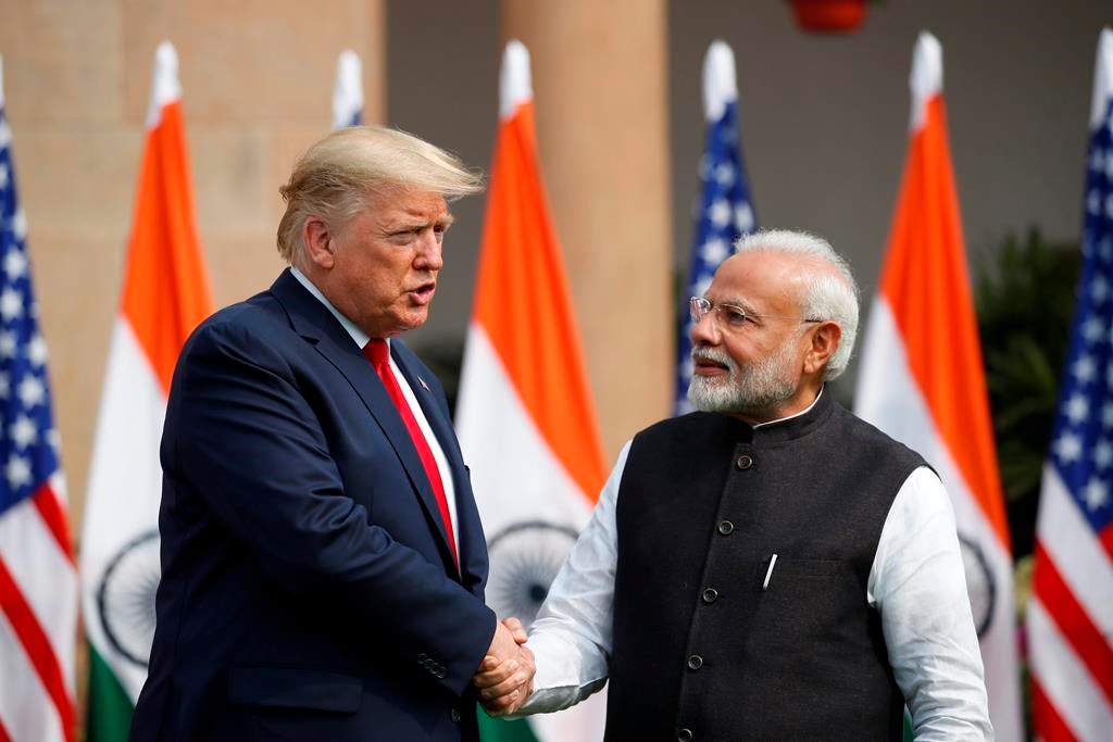 U.S. President Donald Trump and Indian Prime Minister Narendra Modi shake hands before their meeting at Hyderabad House in New Delhi, India, Tuesday, Feb. 25, 2020. (AP Photo/Alex Brandon)