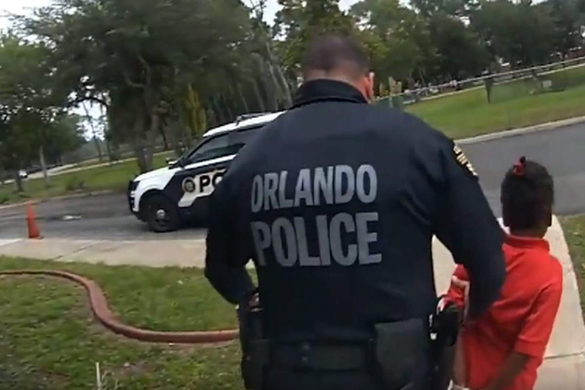 In this image taken from Sept. 19, 2019, Orlando Police Department body camera video footage, an Orlando police officer leads six-year-old Kaia Rolle away after her arrest.