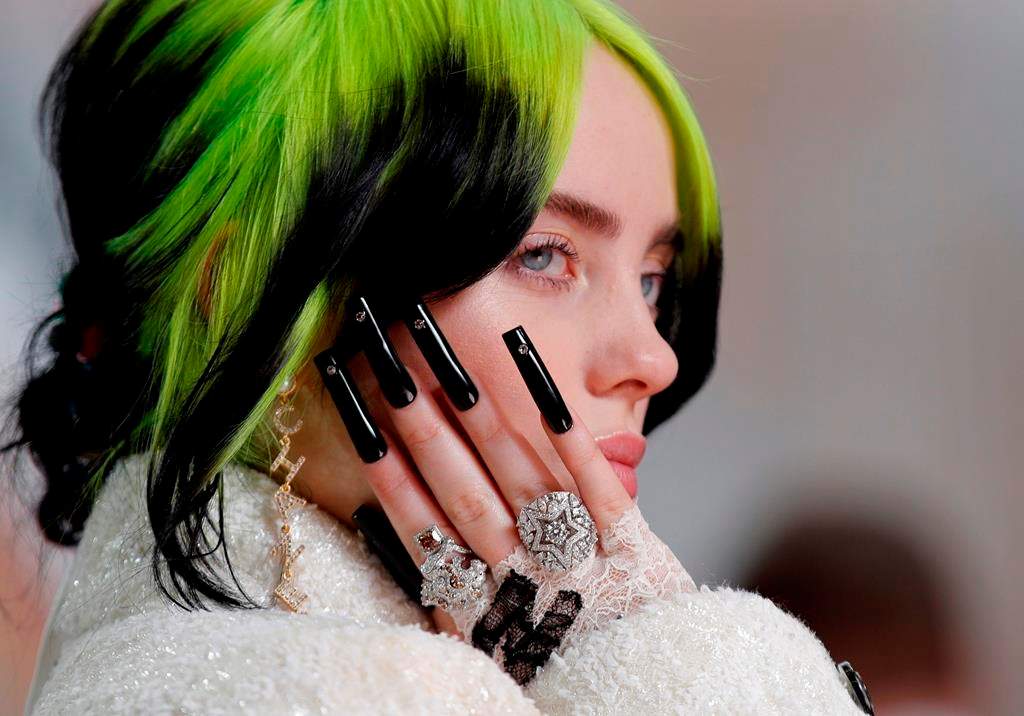 In this Sunday, Feb. 9, 2020 file photo Billie Eilish arrives at the Oscars at the Dolby Theatre in Los Angeles, Calif.