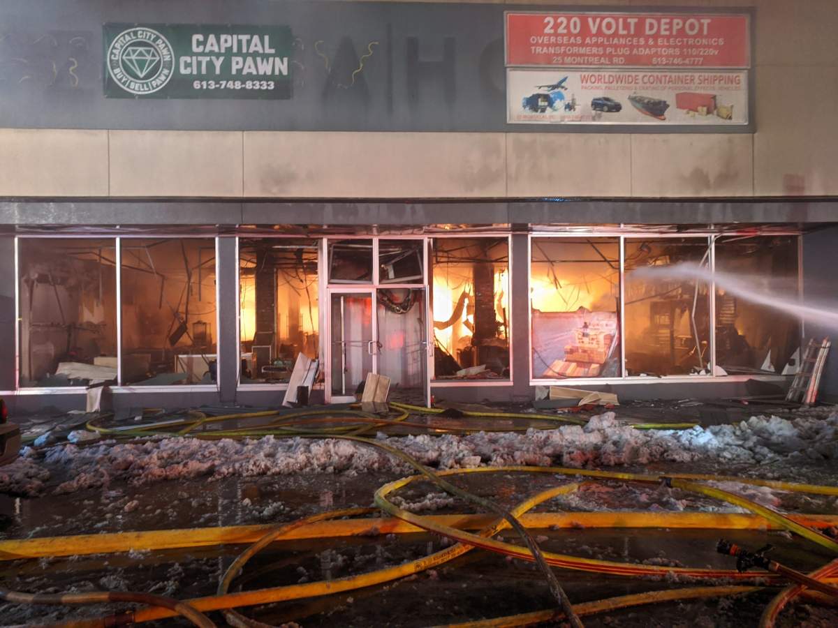 Ottawa firefighters battle a three-alarm blaze that broke out in a mixed-use building on Montreal Road in Vanier, east of downtown, on Thursday evening.
