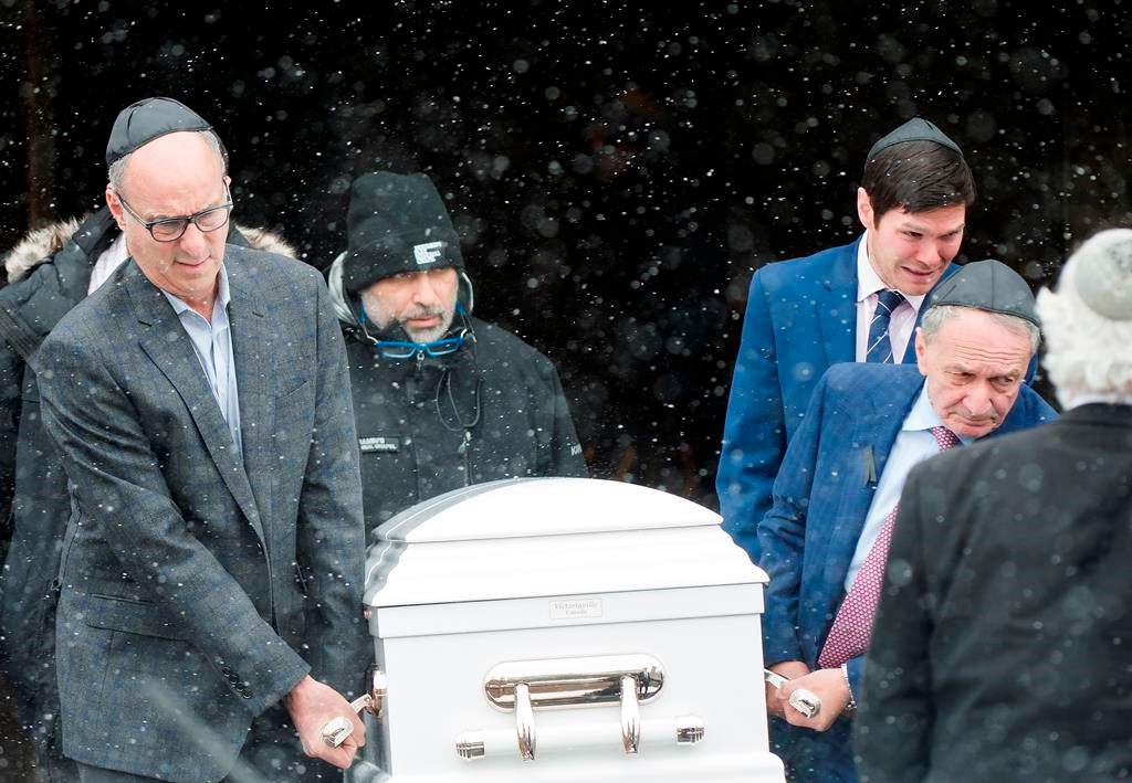 People carry the casket at the funeral for four-year-old Keira Kagan in Toronto on Thursday, February 13, 2020. Kagan’s body was found alongside her father’s at the bottom of an escarpment west of Toronto.