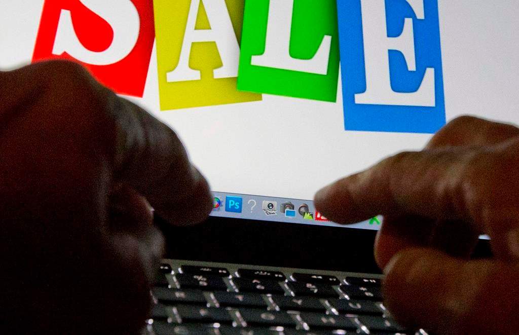 In this file photo, a person searches the internet for sales.