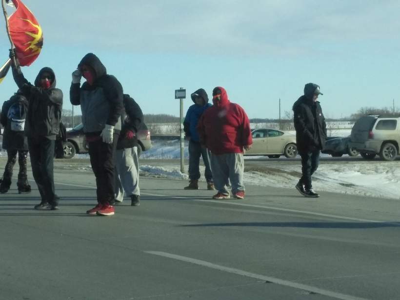 Protesters block traffic near Deacon\’s Corner Monday.