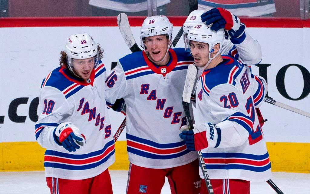 New York Rangers' Ryan Strome, centre, celebrates his goal against the Montreal Canadiens with teammates Artemi Panarin, left, and Chris Kreider during third period NHL action in Montreal on Thursday, Feb. 27, 2020.
