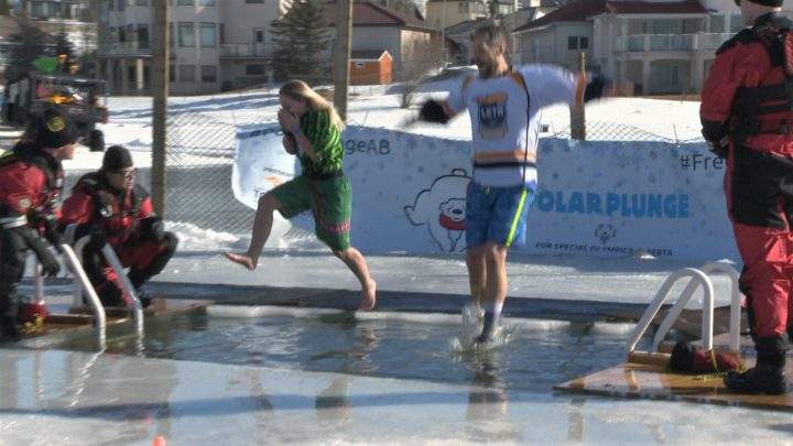 People jumped into cold Calgary waters for the Polar Plunge at Arbour Lake on Saturday, Feb. 22, 2020.