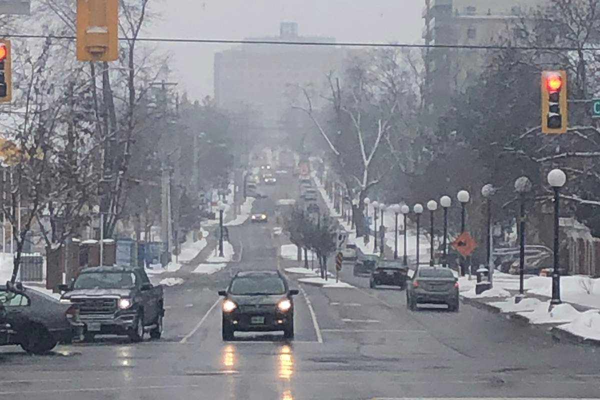 Snow falls on Queen Street in Kitchener.