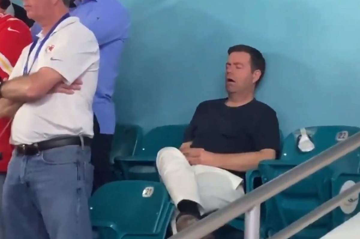 A man is shown sleeping during Super Bowl LIV at Hard Rock Stadium in Miami Gardens, Fla., on Feb. 2, 2020.