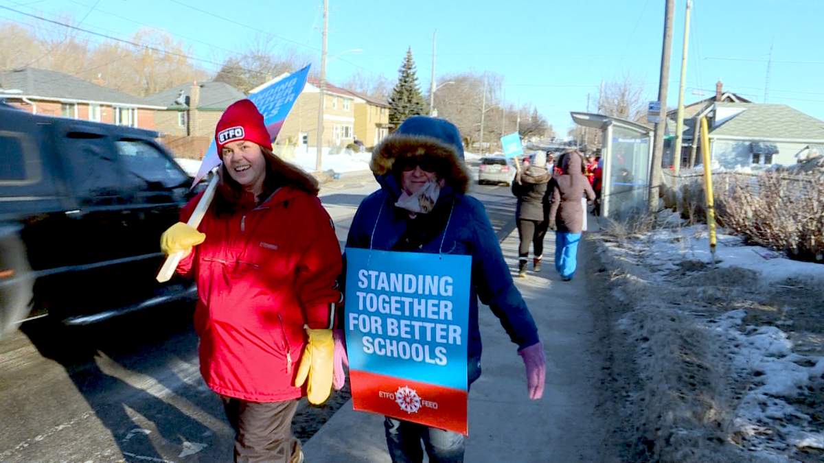 Teachers walk the picket line outside Regiopolis-Notre Dame Catholic Secondary School in Kingston, Ont.