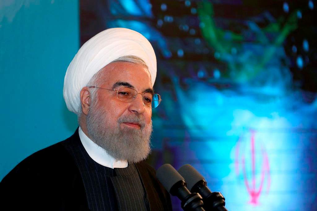 In this photo released by the official website of the office of the Iranian Presidency, President Hassan Rouhani speaks in a ceremony inaugurating a new highway that connects Tehran to the north of the country, Iran, Tuesday, Feb. 25, 2020.