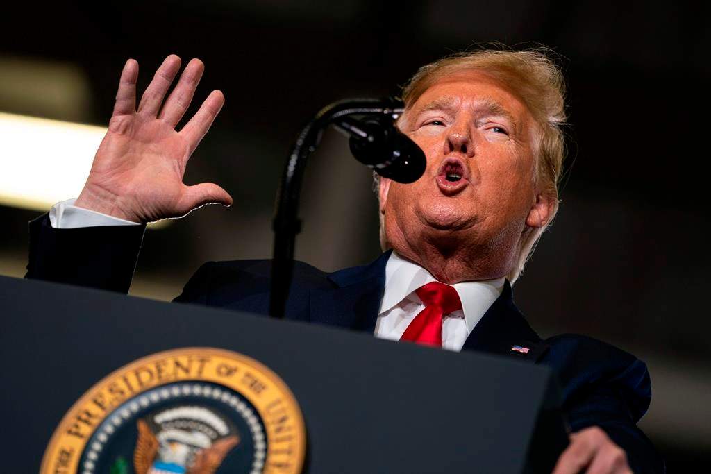 FILE- In this Jan. 28, 2020, file photo, President Donald Trump speaks during a campaign rally at the Wildwoods Convention Center Oceanfront in Wildwood, N.J. Trump will be facing his accusers Tuesday night during his State of the Union speech. The impeached president is speaking on the eve of what's anticipated to be his Senate acquittal on Wednesday.