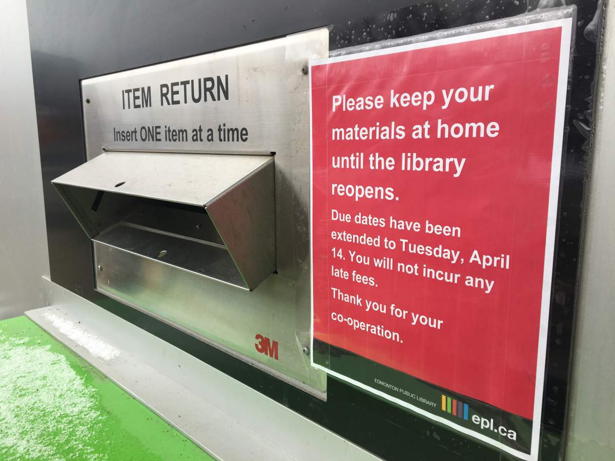 A sign at the drop-off box at an Edmonton Public Library branch, March 30, 2020.