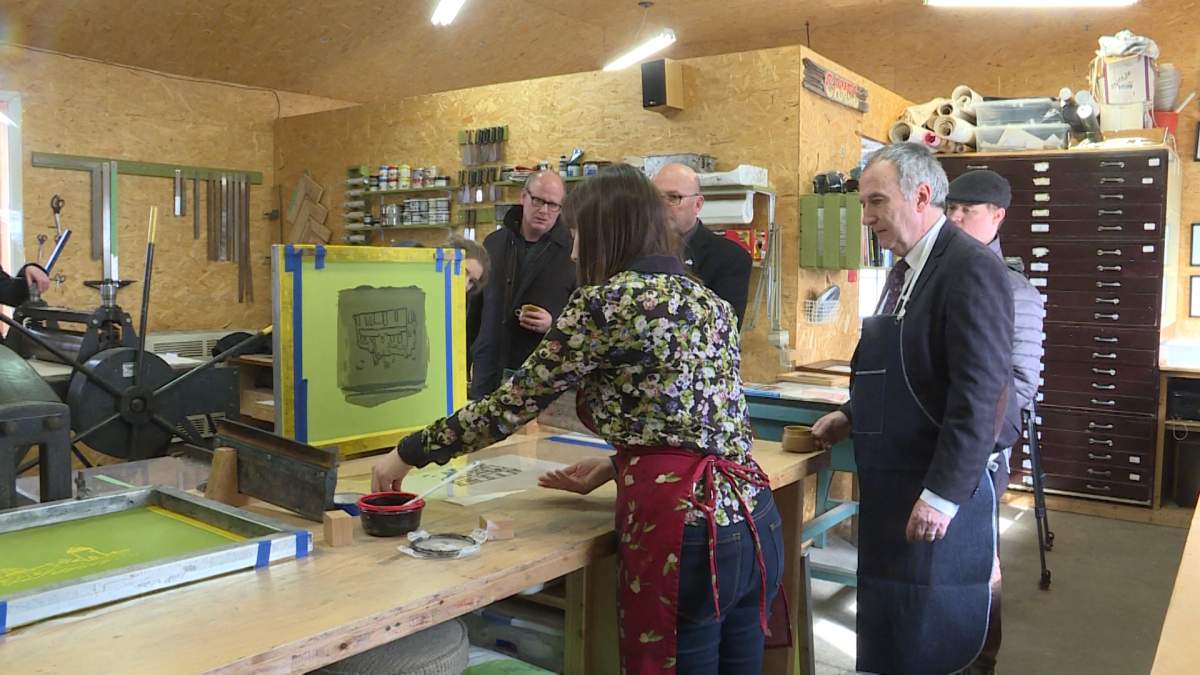 MP Neil Ellis for Bay of Quinte visits a local printing shop after announcing an investment of $300,000 will be put towards the tourism sector in Prince Edward County. 