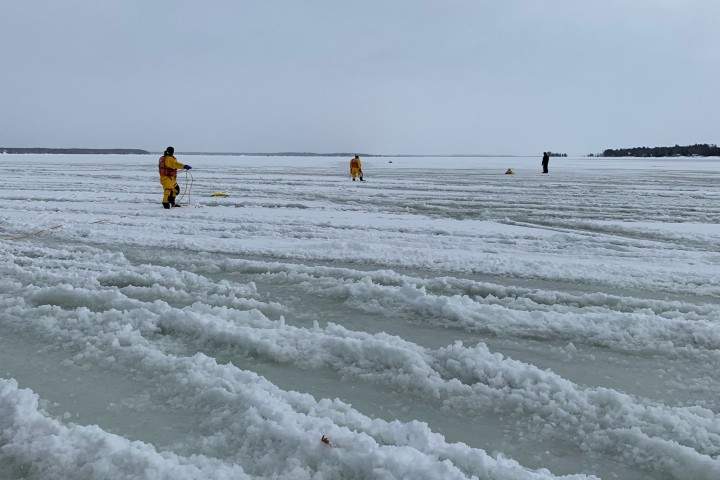 Police say they arrived before other emergency services and helped the four individuals on three machines, who had driven into heavy slush and open water.