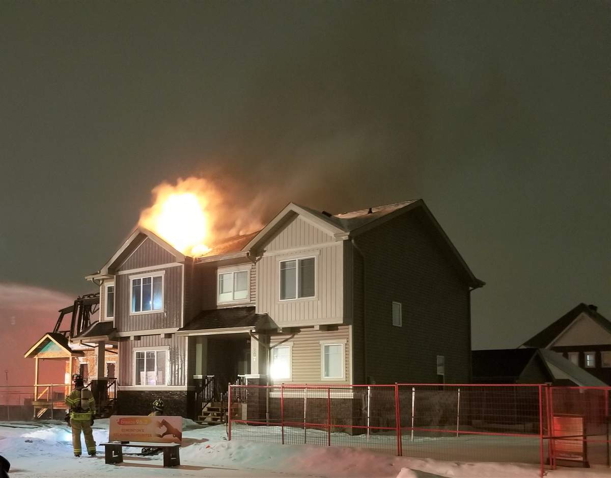 Edmonton Fire Rescue Services responds to a blaze at a home under construction at 203 Griesbach Rd. N.W. on Monday, March 23, 2020.