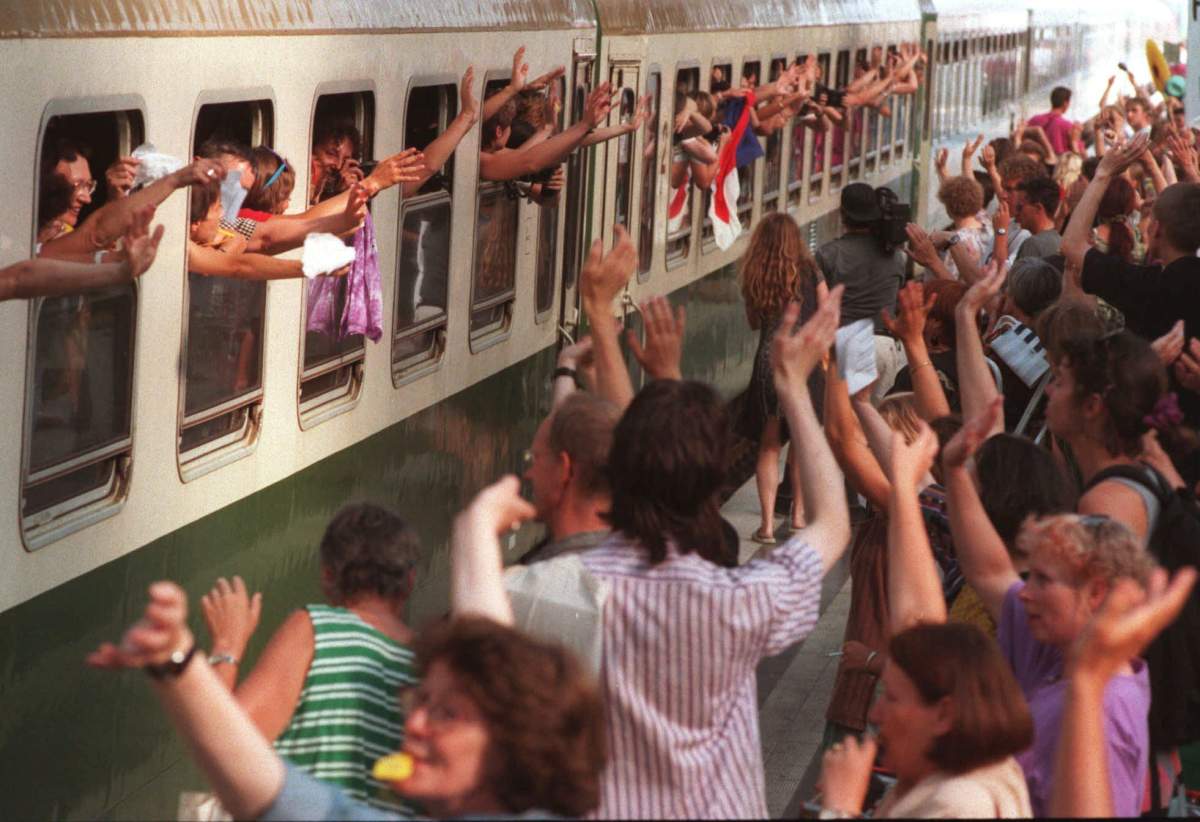Women wave goodbye out of the “Women’s Train” shortly before it leaves Berlin’s main station on its way to Warsaw, Sunday, August 20, 1995. Berlin was a stop-over for the 150 women on their 10,000-kilometre journey from Paris to Beijing for the global conference on women.