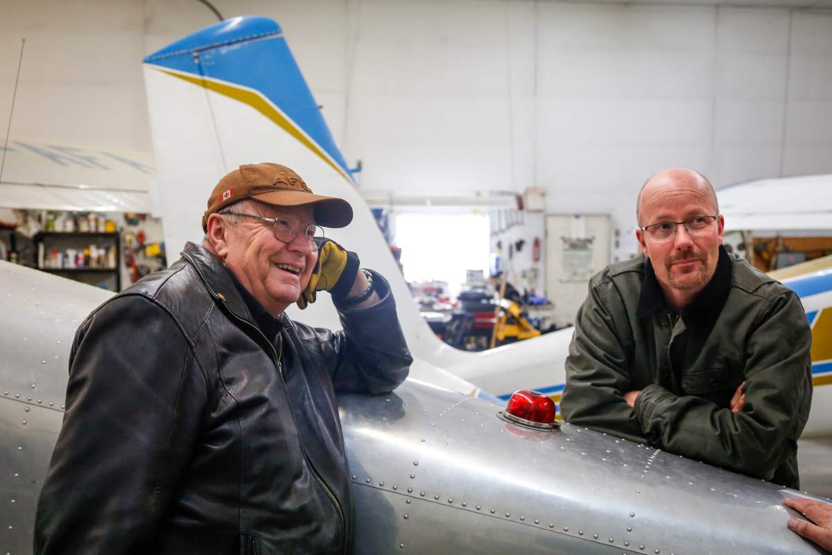 Richard Reid, left, and his son David Reid, who are both farmers and pilots, with their current planes at their farm near Cremona, Alta., Wednesday, March 4, 2020.