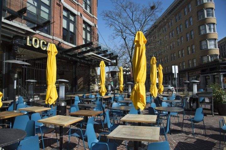 An empty patio is seen on St. Patrick's Day in Gastown in downtown Vancouver Tuesday, March 17, 2020. 