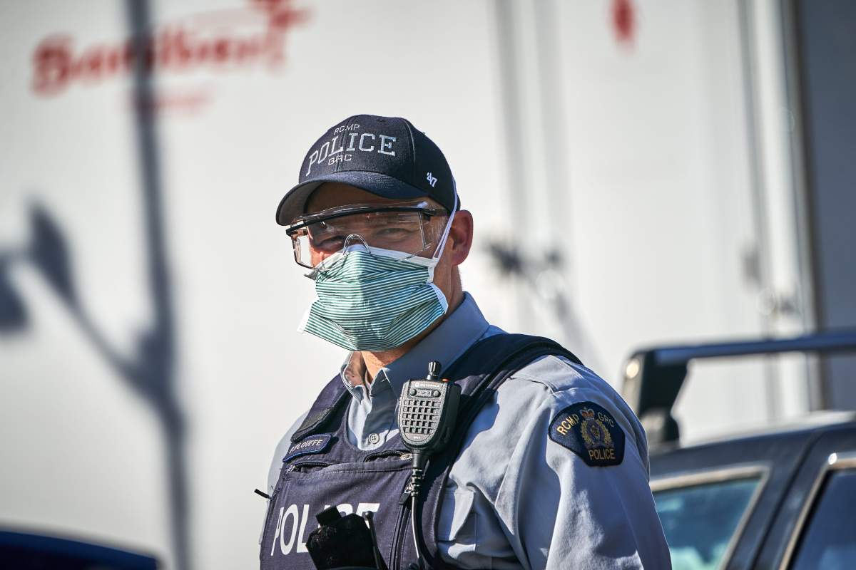 Canadian federal police (RCMP) officer on guard at Roxham road at Saint-Bernard-de-Lacolle, Quebec, Canada, 20 March 2020. US President Donald J. Trump and Canadian Prime Minster Justin Trudeau announced on 20 March that the Canadian-US border will be closed to non-essential traffic to slow the spread of the COVID-19 coronavirus pandemic. Countries around the world are taking increased measures to stem the widespread of the SARS-CoV-2 coronavirus which causes the Covid-19 disease.  