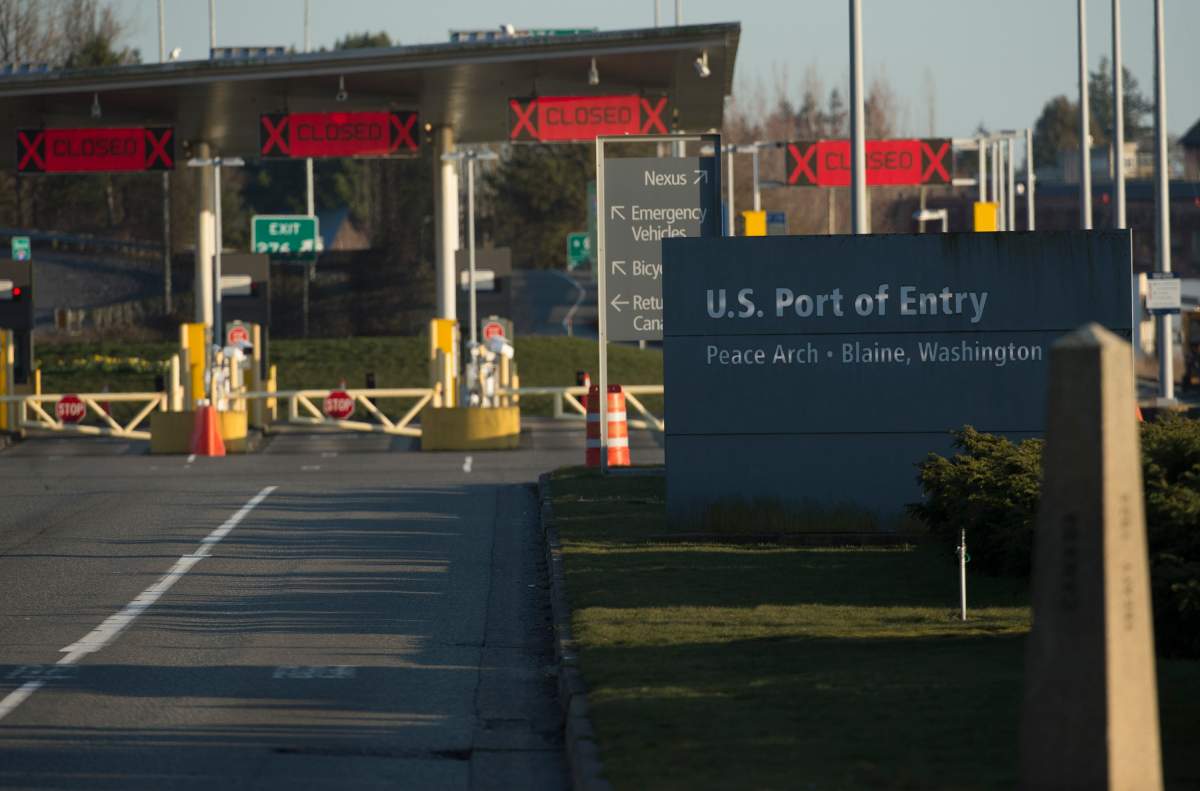 The United States border crossing is pictured at the Peace Arch Canada/USA border in Surrey, B.C. Friday, March 20, 2020. New restrictions in effect at midnight Friday along Canada's shared border with the United States focus more on blocking tourists and bargain-hunters than on clearing the way for so-called "essential" travel such as truckers hauling freight, health professionals and others who live on one side and work on the other. 