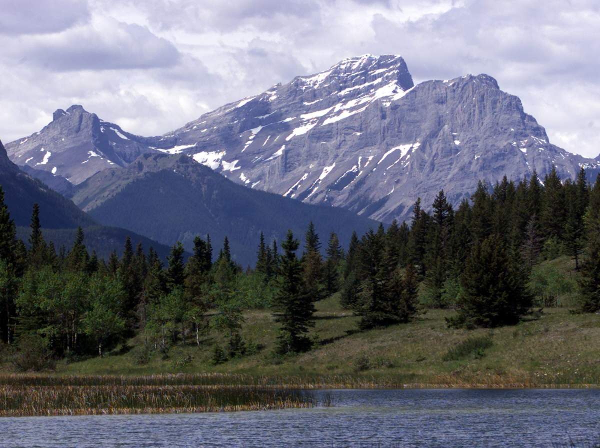 Mt McGillivray is seen in the distance over Middle Lake in the Bow Valley Provincial Park, Saturday June 18, 2000.