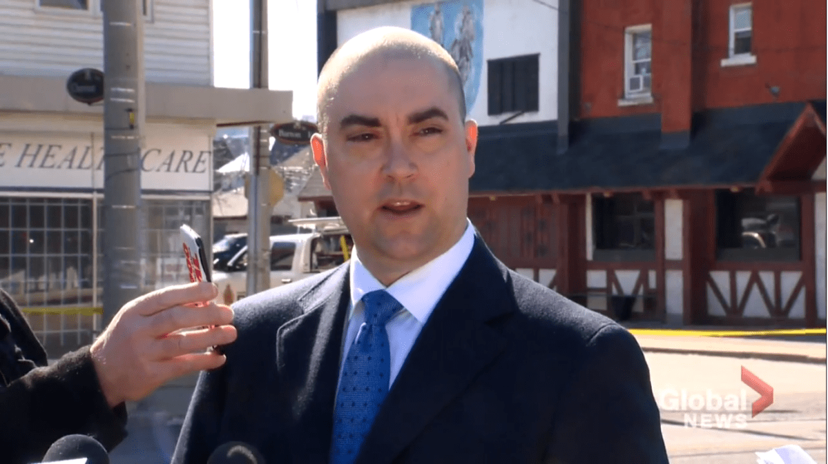 Det. Sgt. Steve Berezuik outside Sam’s Tavern following a targeted shooting at the bar early on March 8. Homicide detectives believe about 100 people were in the area around the time of the shooting.