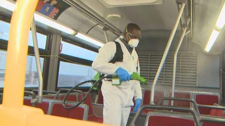 Cleaners disinfect a TTC bus during a demonstration on March 3.