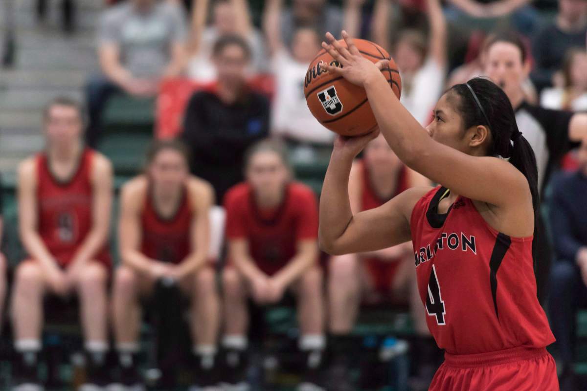 Carleton Ravens guard Jenjen Abella (4) takes a foul shot during the U Sports Women's Basketball final at University of Regina in Regina, Saskatchewan on Sunday, March 11, 2018.