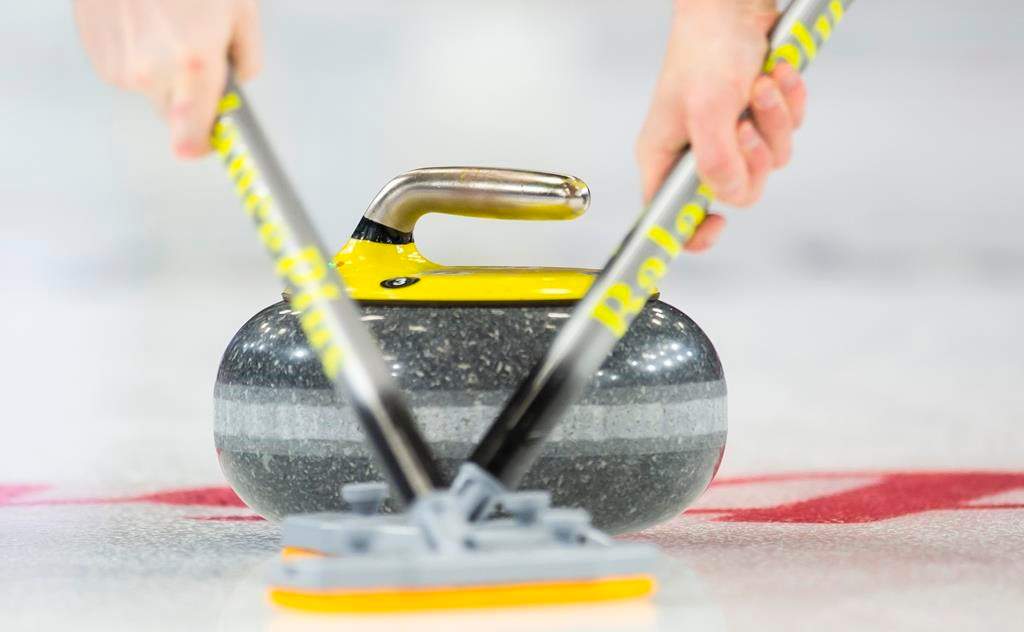Members of team P.E.I. sweep their rock during the 9th draw against team Quebec at the Brier in Brandon, Man., Tuesday, March 5, 2019.