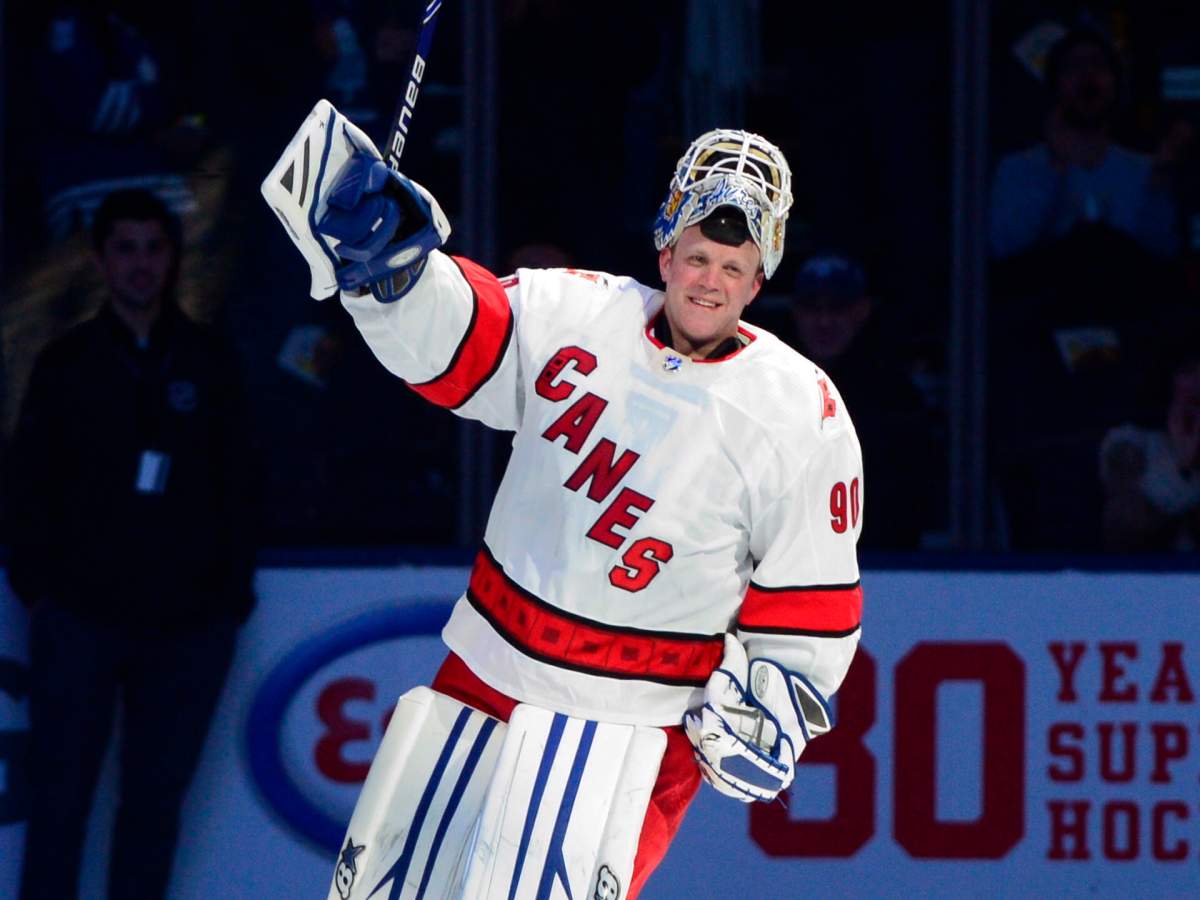 Carolina Hurricanes emergency goaltender David Ayres skates a lap after being named the game's first star after they beat the Toronto Maple Leafs 6-3 in NHL hockey action in Toronto, Saturday, Feb. 22, 2020.