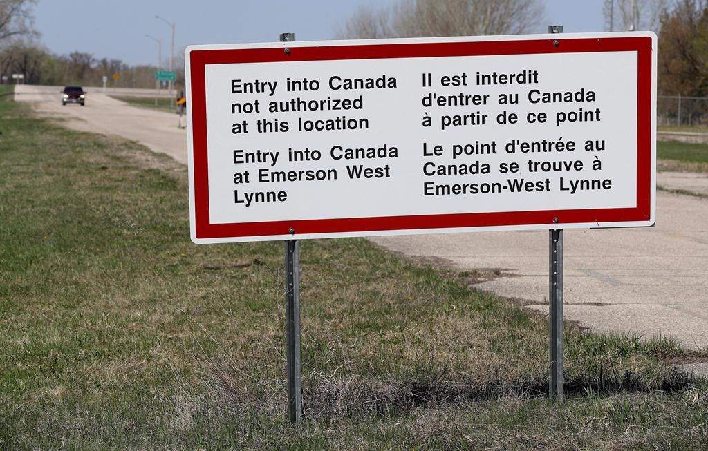 A sign is seen near the border near Emerson, Man.