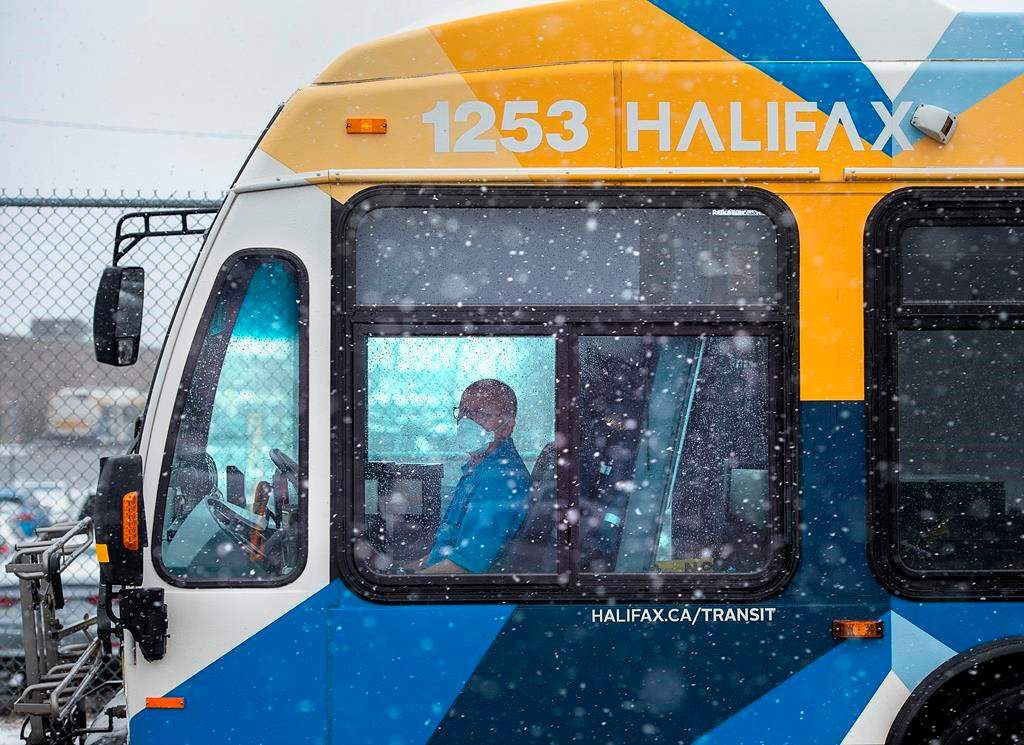 A driver waits at a stop outside the Halifax Transit Burnside maintenance depot Dartmouth, N.S., on Thursday, March 26, 2020.