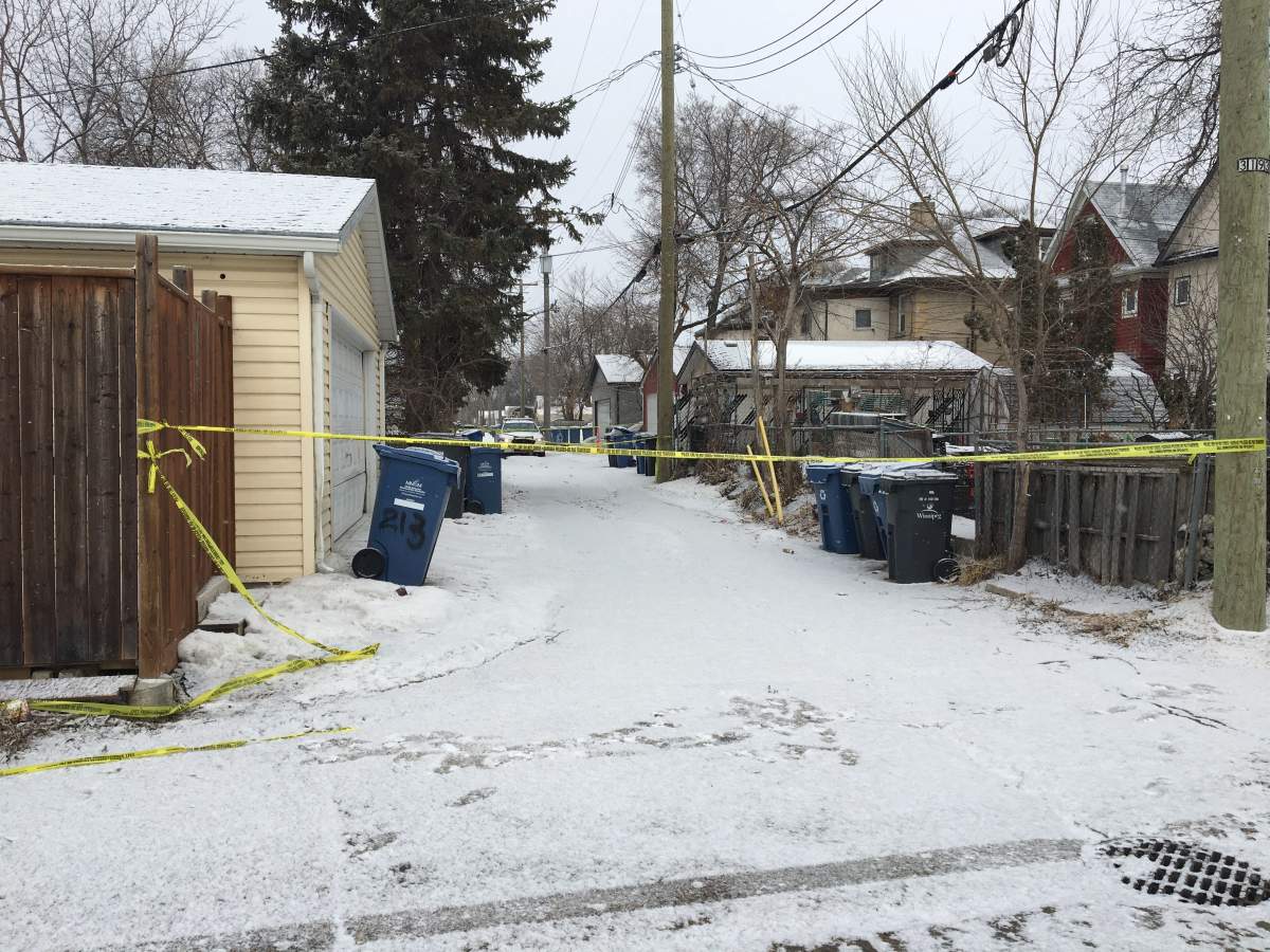 Police in the back lane of Lansdowne Avenue.