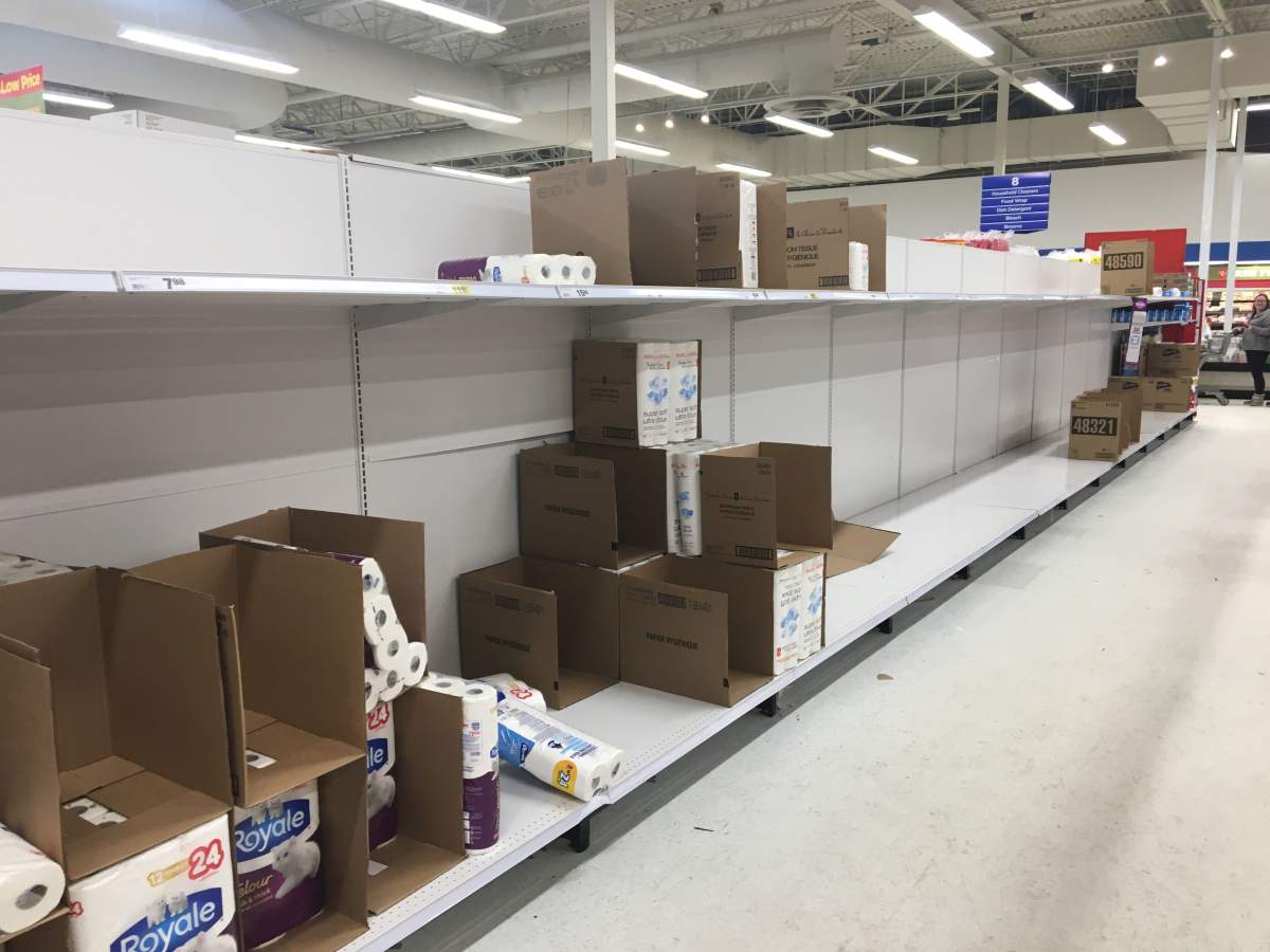 Bare toilet paper shelves inside a Superstore in Edmonton, Alta. on Saturday, March 7, 2020.