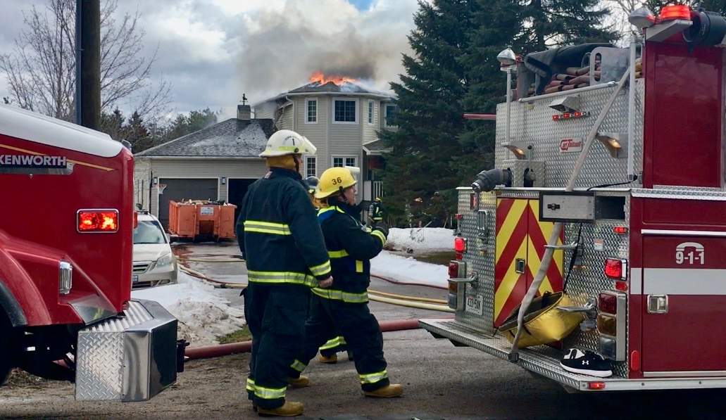 Selwyn Township fire-fighters battle a house fire on Brick Road in Ennismore on Friday morning.