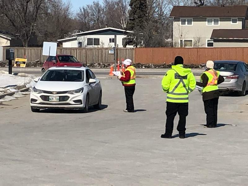Drive-thru tests are conducted in this photo from early in the pandemic.