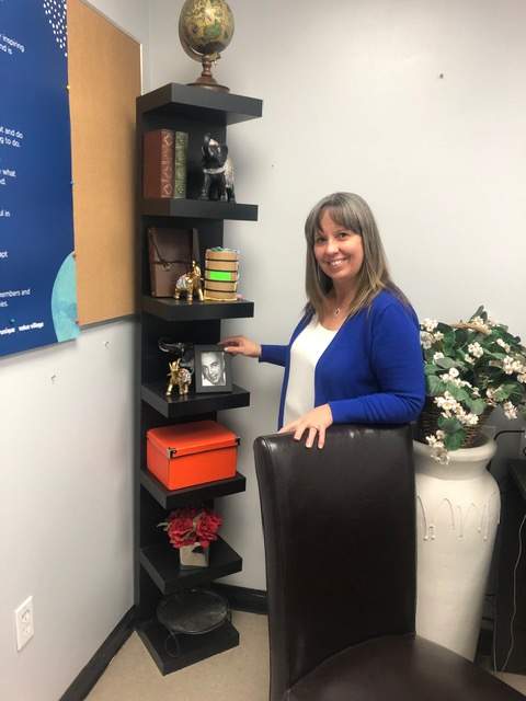 Manager Jenn Folco with Rick’s photo in her office.