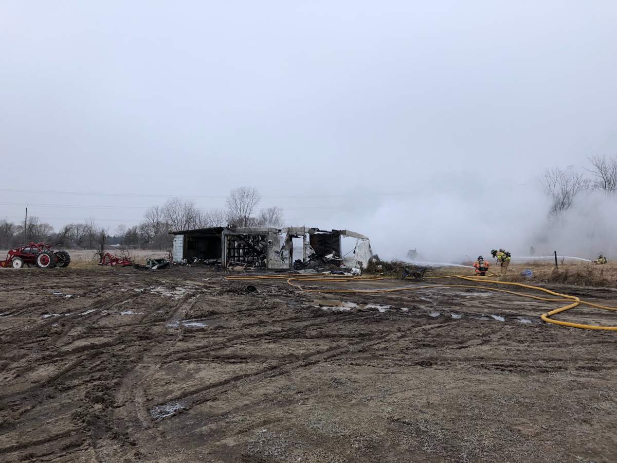 London firefighters tend to a barn fire on Bostwick Road on Wednesday morning.