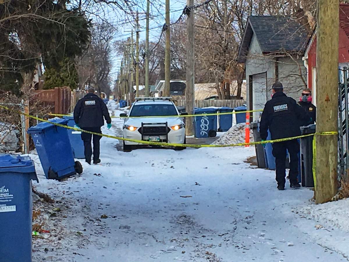 Winnipeg police investigate after a man's body was found in a trash bin in a backlane in the 200 block of Lansdowne Avenue Wednesday.