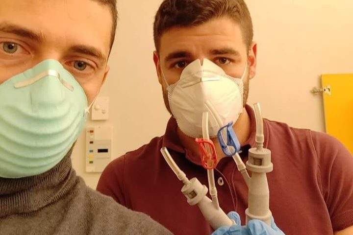 Cristian Fracassi, left, and his Isinnova colleague Alessandro Ramaioli show off their 3D-printed valves in Italy.