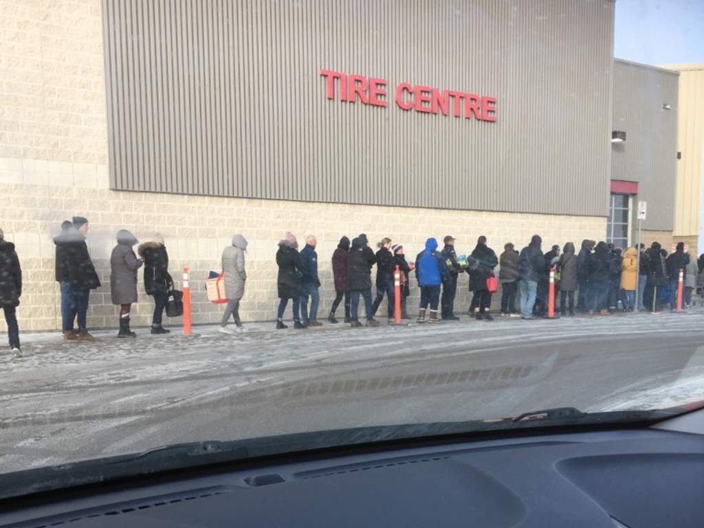 Shoppers lined up at Costco on McGillivray Boulevard Friday morning.